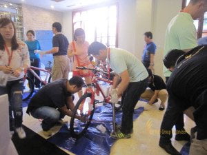 Finalizing Bicycle Reconstruction - Fireeye Bali CSR | Corporate Social Responsibility fireEye, singapore, bali, csr, corporate, social, responsibility, charity, orphanage, bali csr, bali charity, bicycle reconstruction, FireEye group