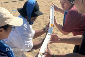GBPN Indonesia team solving a group challenge during Bali Team Building in Sanur