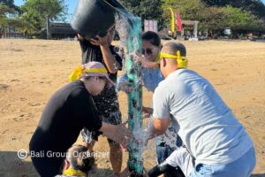 GBPN Indonesia team completing a water challenge during Bali Team Building on Sanur Beach