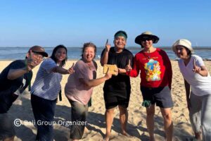 GBPN Indonesia team celebrating during beach team building activities in Bali